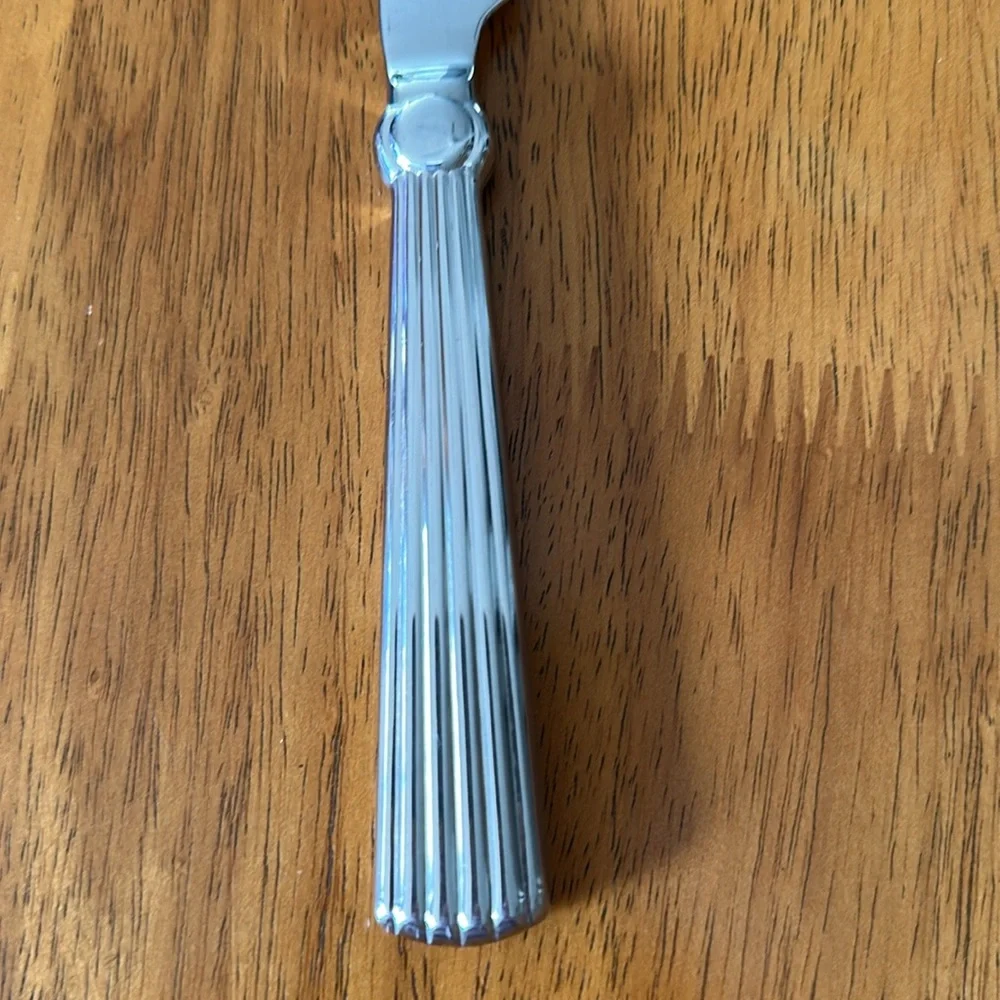Waterford stainless butter knife. 18/10 handle. Carleton pattern. 9 3/4”.